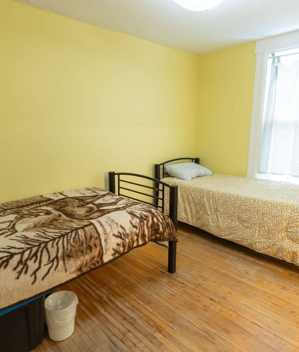 Grace House: A clean bedroom featuring two beds