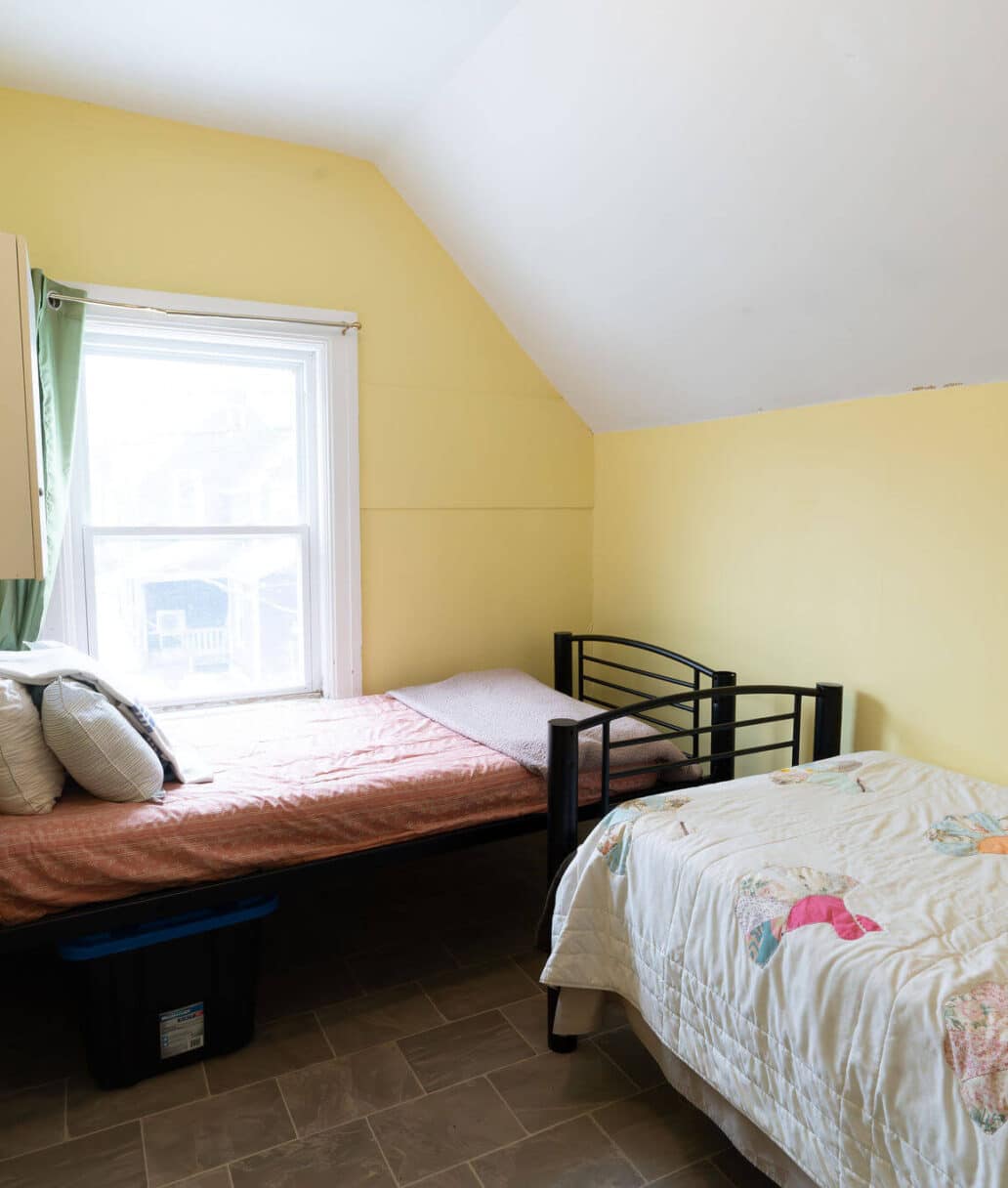 Grace House: A clean bedroom featuring two beds