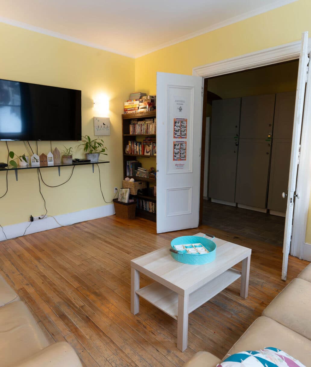 Grace House: A living room area with two sofas and a TV