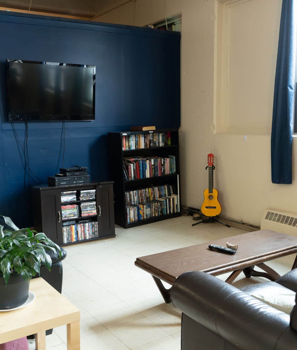 St John House: A living room area with two sofas and a TV