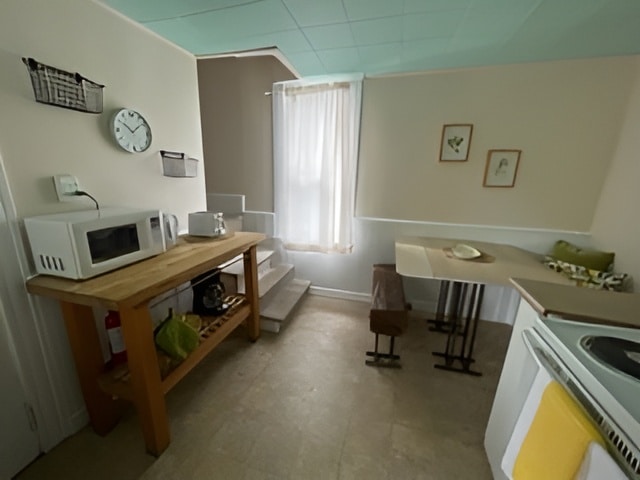 Goddard House: A kitchen area with prep station and tables