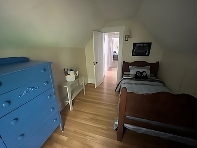 Goddard House: A private bedroom with twin bed and blue dresser